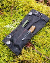 waxed canvas tray folded in half with 2 pockets for EDC filled with tools in black